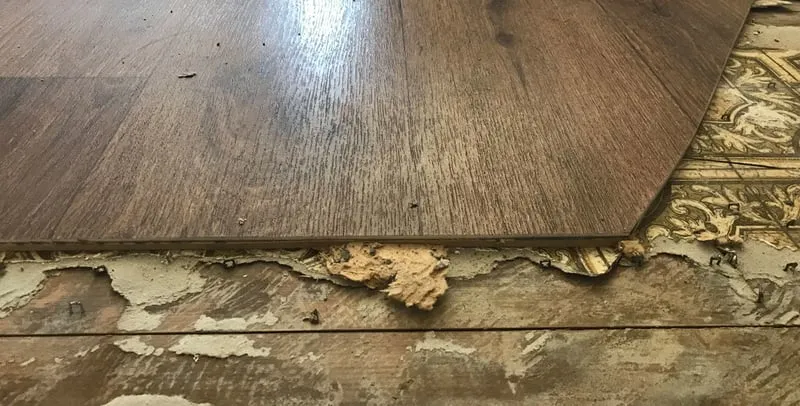 Old floor tile that may contain asbestos