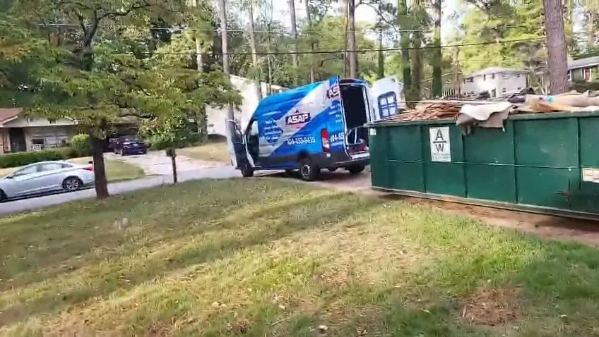ASAP Restoration truck and dumpster outside a fire job