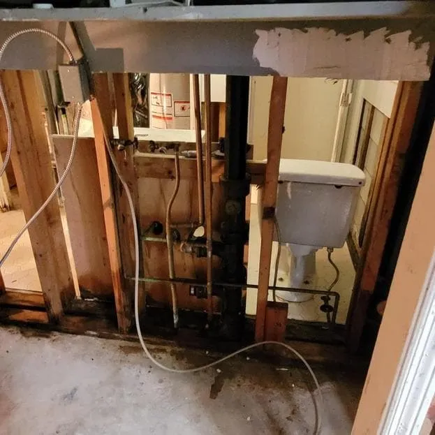 Wall opened to reach wet framing