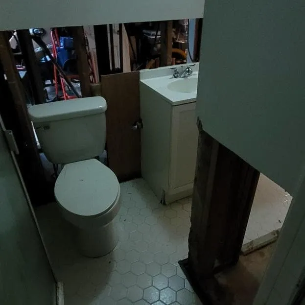 Wet drywall removed along the floor