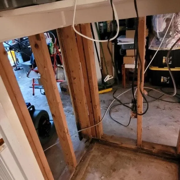 Wall and framing opened below a leak
