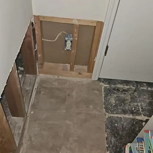 Basement hallway with walls opened