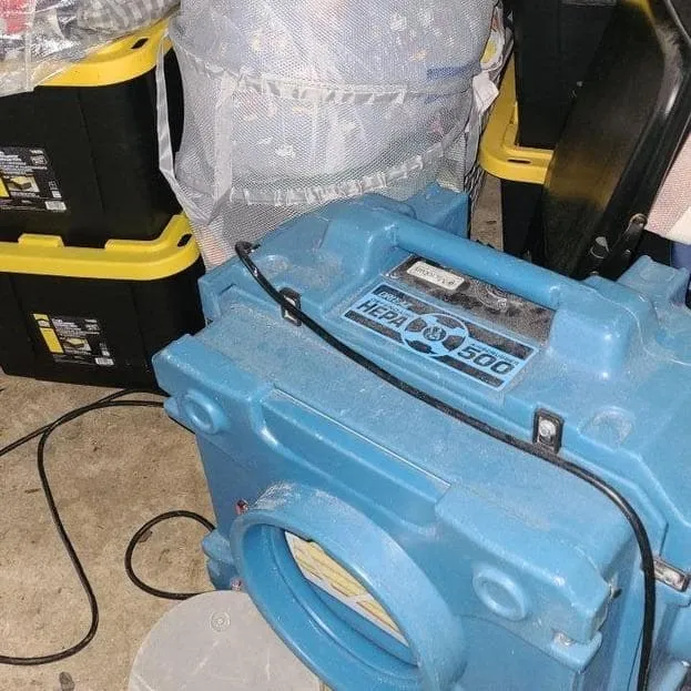 HEPA air scrubber running during removal