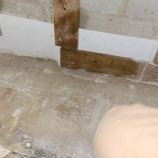 Technician treating the slab edge