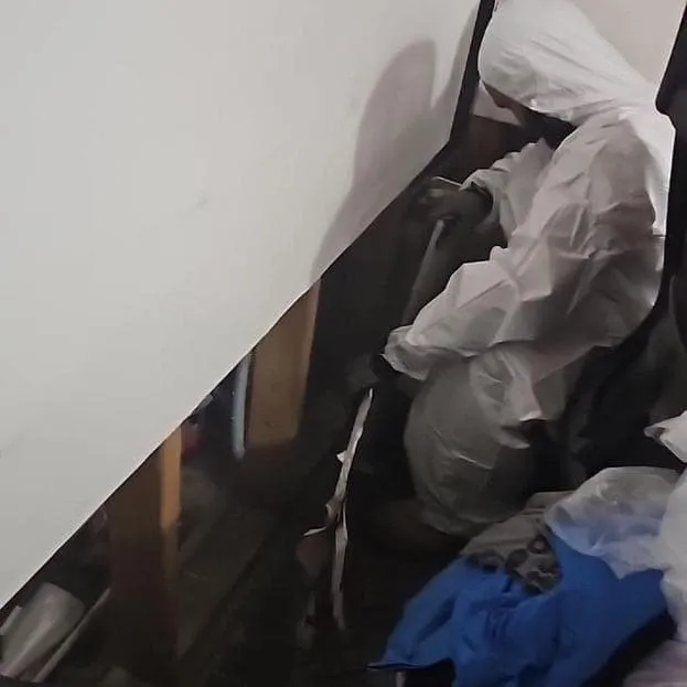 Technician in a Tyvek suit