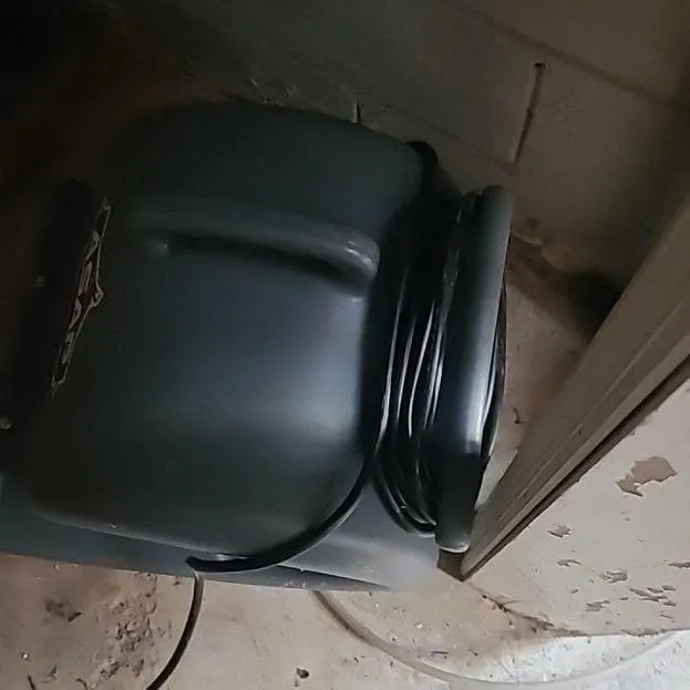 Air mover running on a damp floor