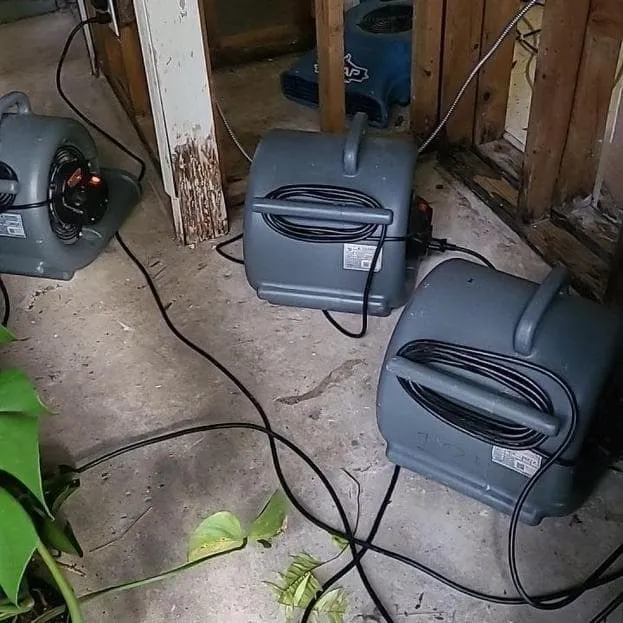 Air movers aimed at opened walls