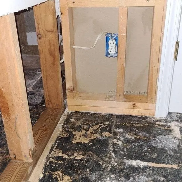 Laundry room wall opened at the bottom after sewage backup