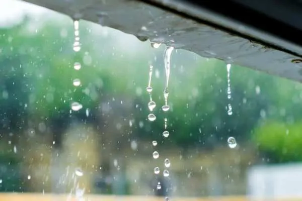 Rain running off a roof edge